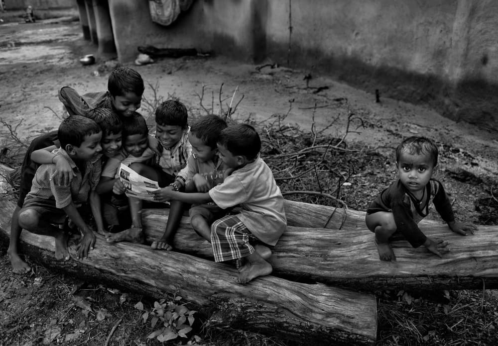 Village Children Reading by Avishek Das — canvas wall art