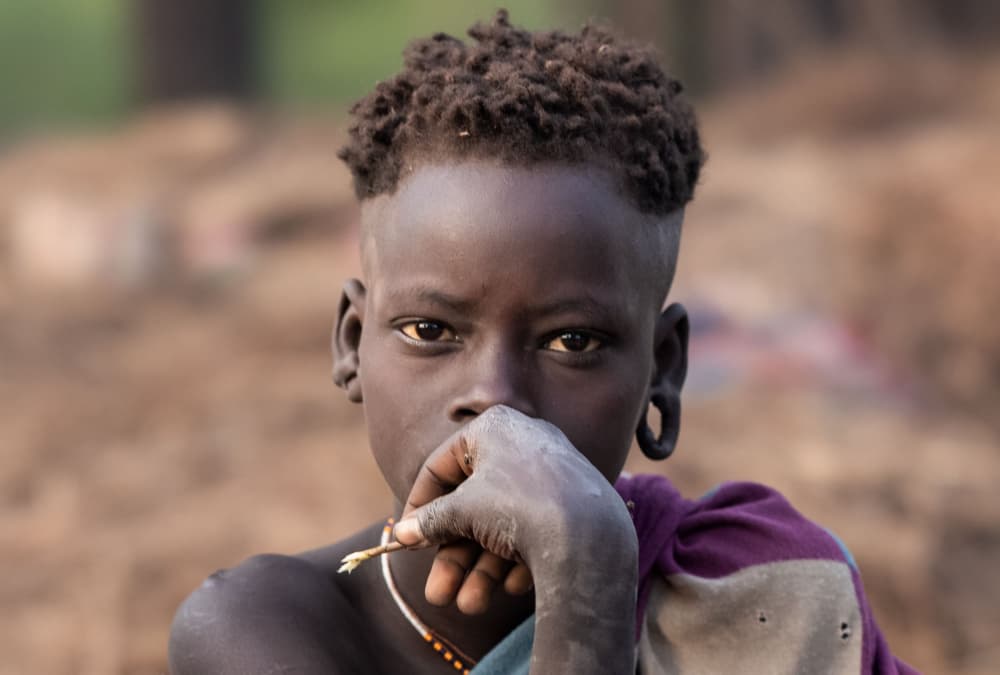 Young African Gaze by Hamza Qarooni — canvas wall art
