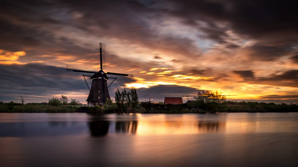 Dutch Windmill Sunset Glow by Gonçalo Capitão — canvas wall art
