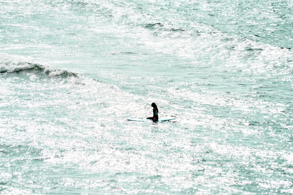 Lone Surfer Shimmering Ocean by Tal Paz-Fridman — canvas wall art