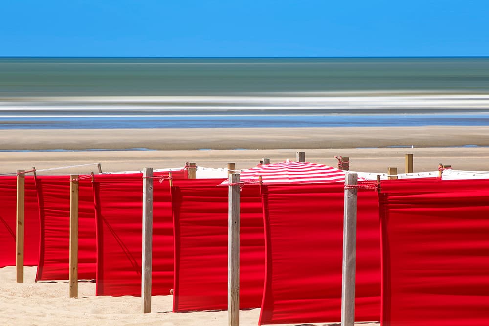 Red Beach Windbreaks by Massimo Della Latta — canvas wall art