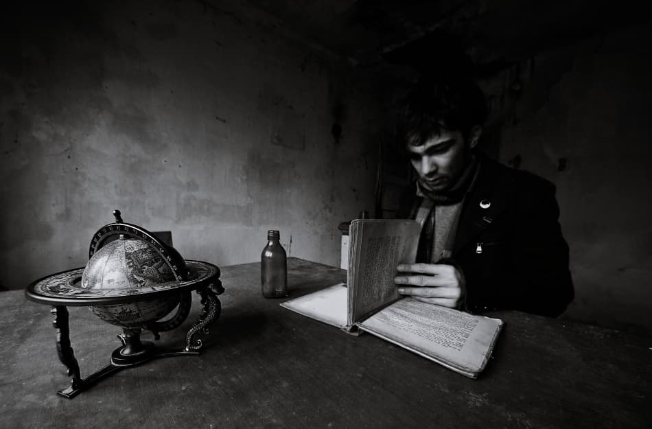 Pensive Man Reading by mario grobenski - psychodaddy — canvas wall art