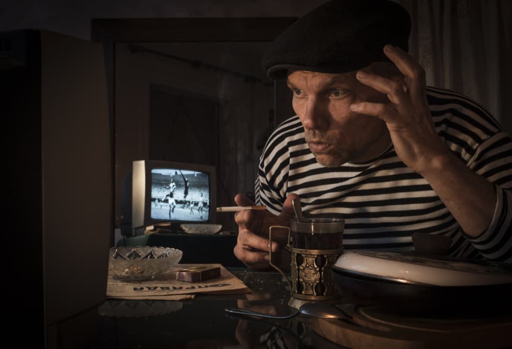 Man Watching Retro TV by Viktor Cherkasov — canvas wall art