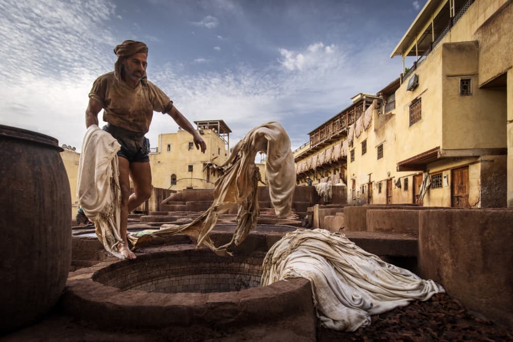 Moroccan Tannery Worker by Dan Mirica — canvas wall art
