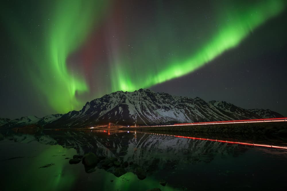 Northern Lights Over Snowy Mountains by James Zhen Yu — canvas wall art