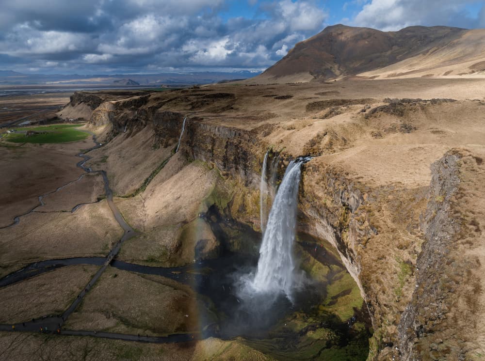 Icelandic Waterfall Rainbow by Jure Kravanja — canvas wall art