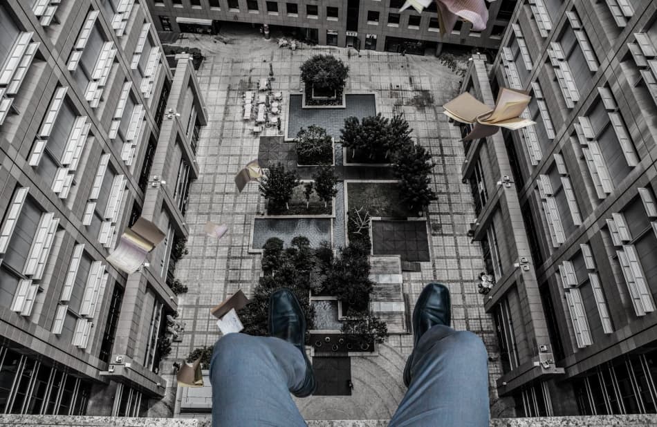 Falling Books City View by Tomer Eliash — canvas wall art