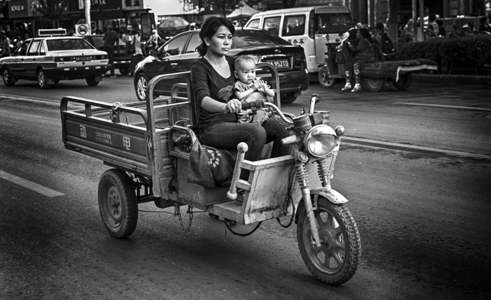 Mother Child City Ride by Angela Muliani Hartojo — canvas wall art