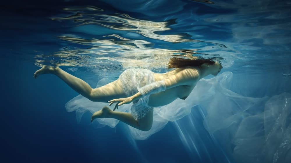 Serene Underwater Float by Dmitry Frizel — canvas wall art