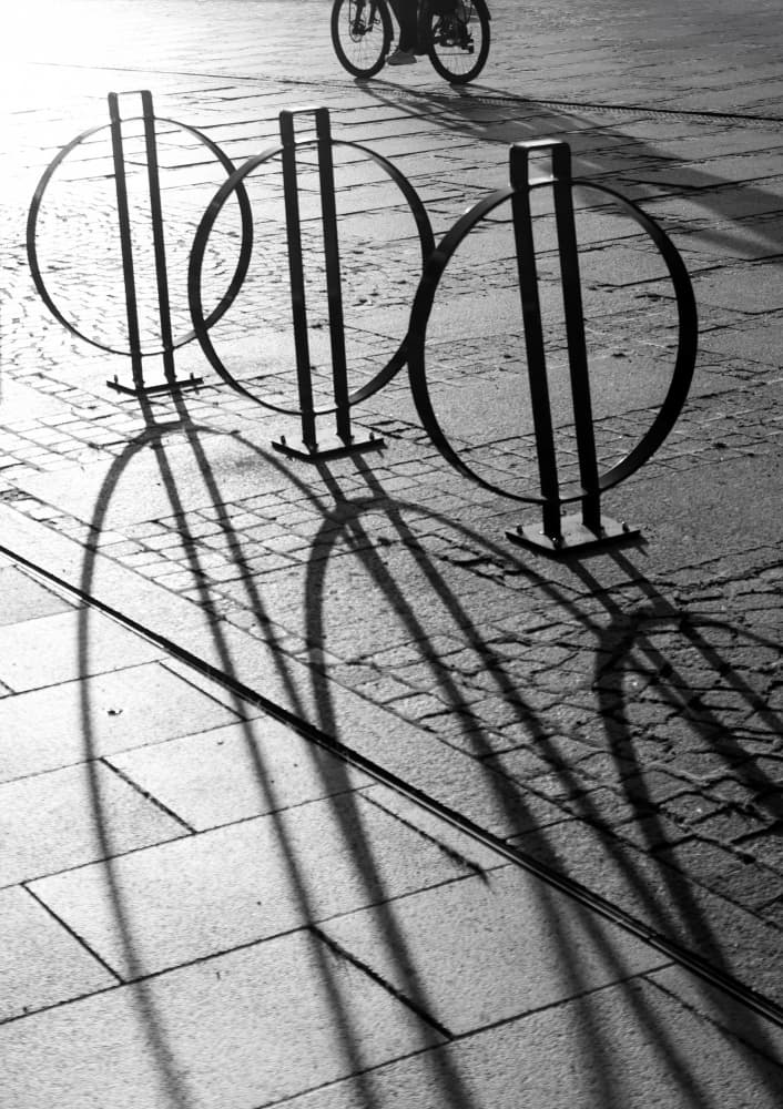 Urban Shadows and Cycles by Anna Niemiec — canvas wall art