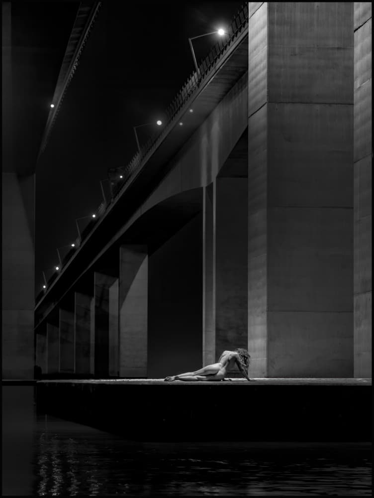Figure Under Bridge Lights by Craig Stampfli — canvas wall art