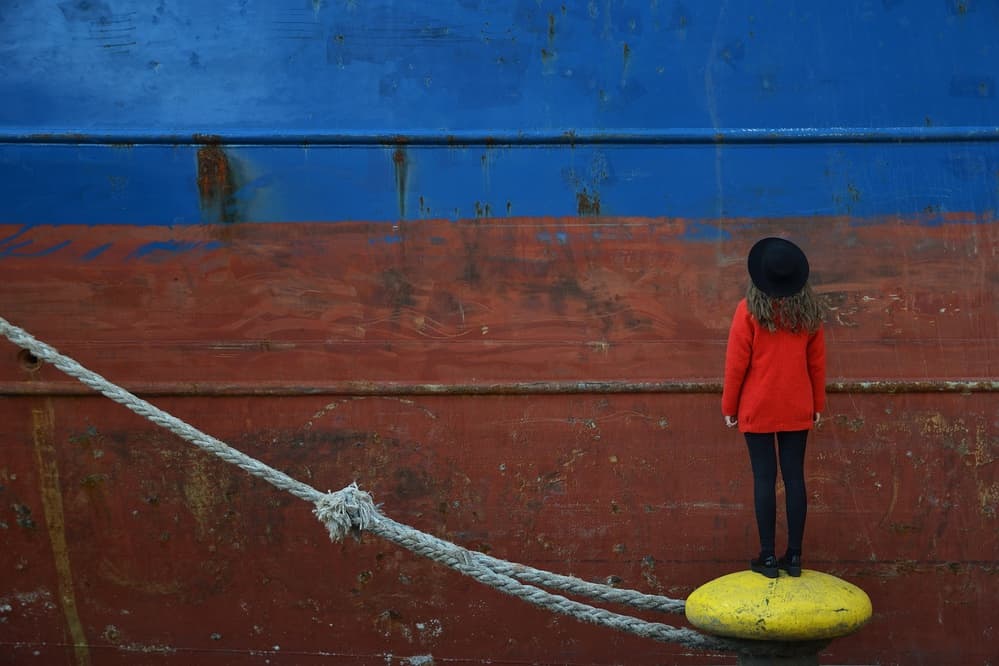 Red Coat Dockside by Emilian Avramescu — canvas wall art