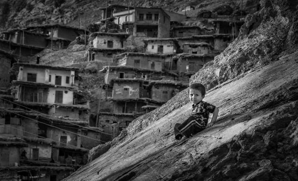 Boy in Hillside Village by Babak Mehrafshar — canvas wall art