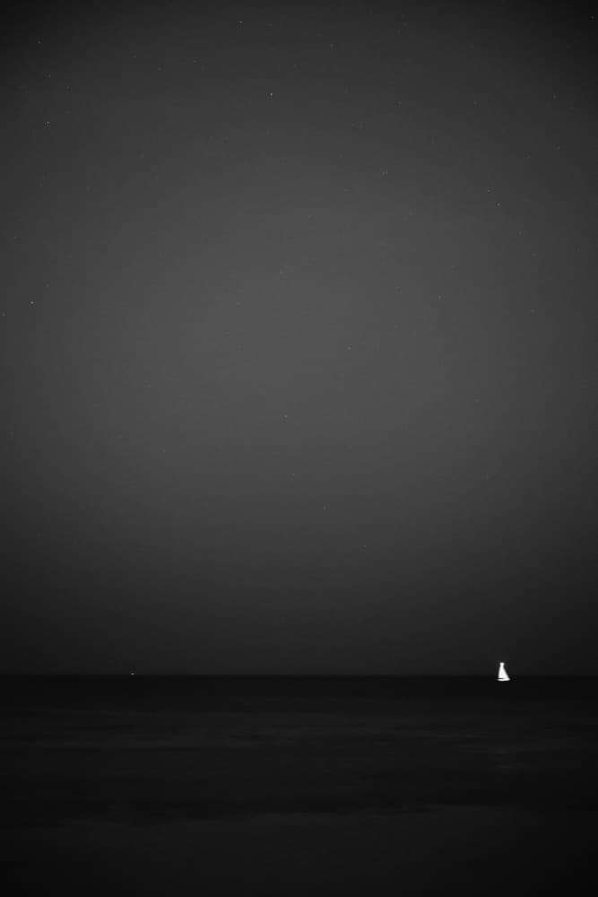 Sailboat on Dark Ocean by Tal Paz-Fridman — canvas wall art