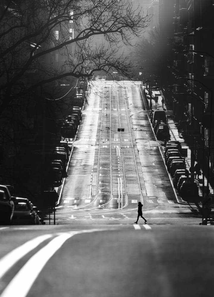Lone Walker on Steep Street by Anna Niemiec — canvas wall art