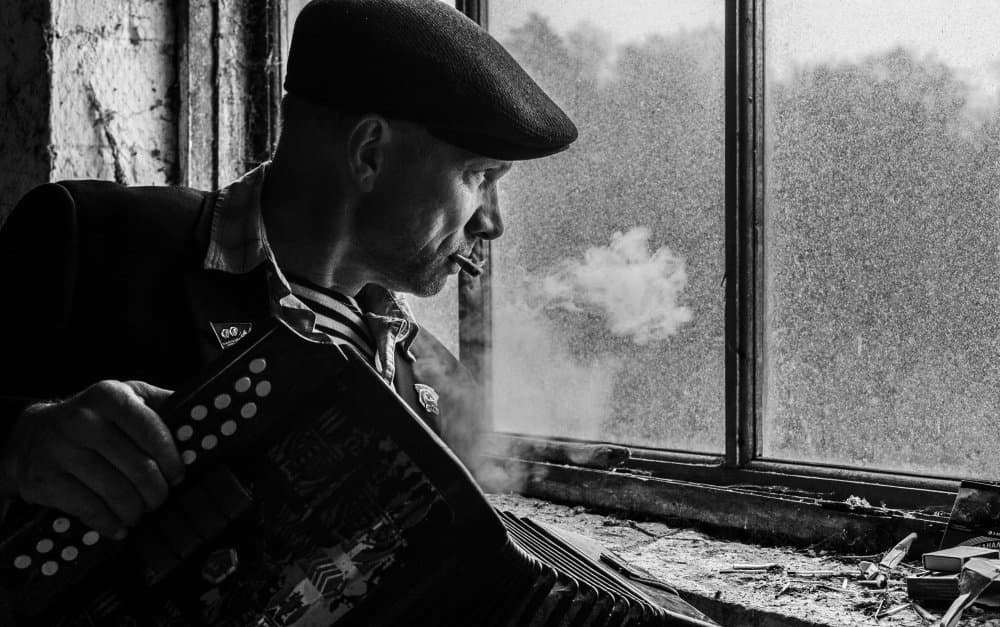Accordionist By Window Smoking by Viktor Cherkasov — canvas wall art
