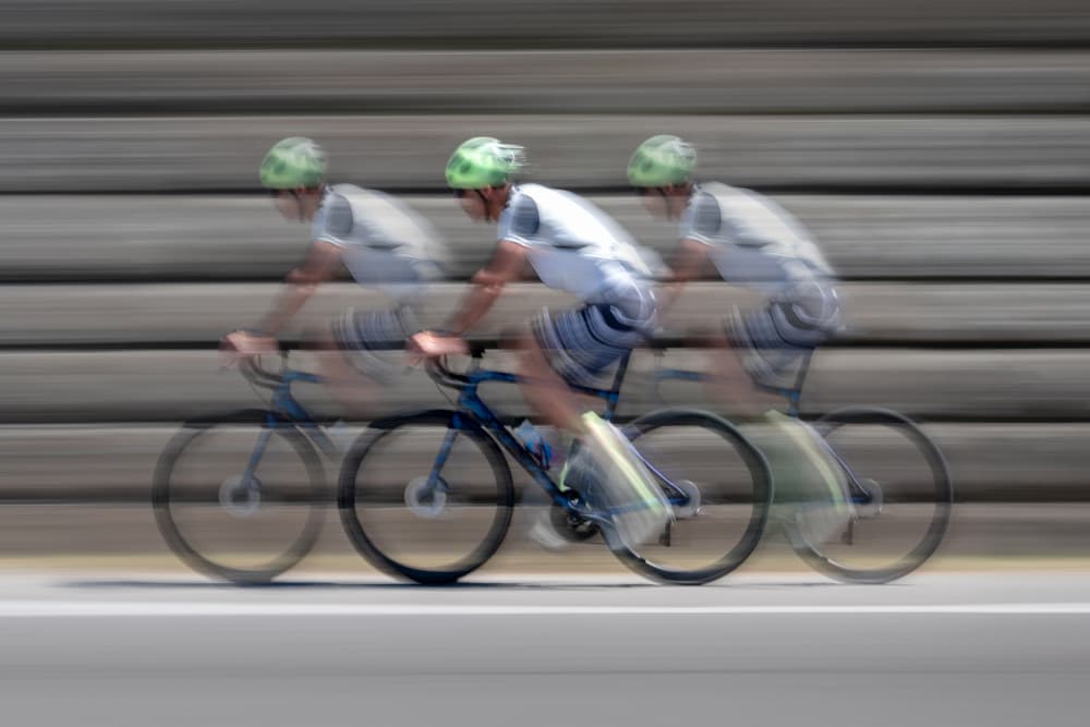 Blurred Cyclist Motion by Andrea Comari — canvas wall art