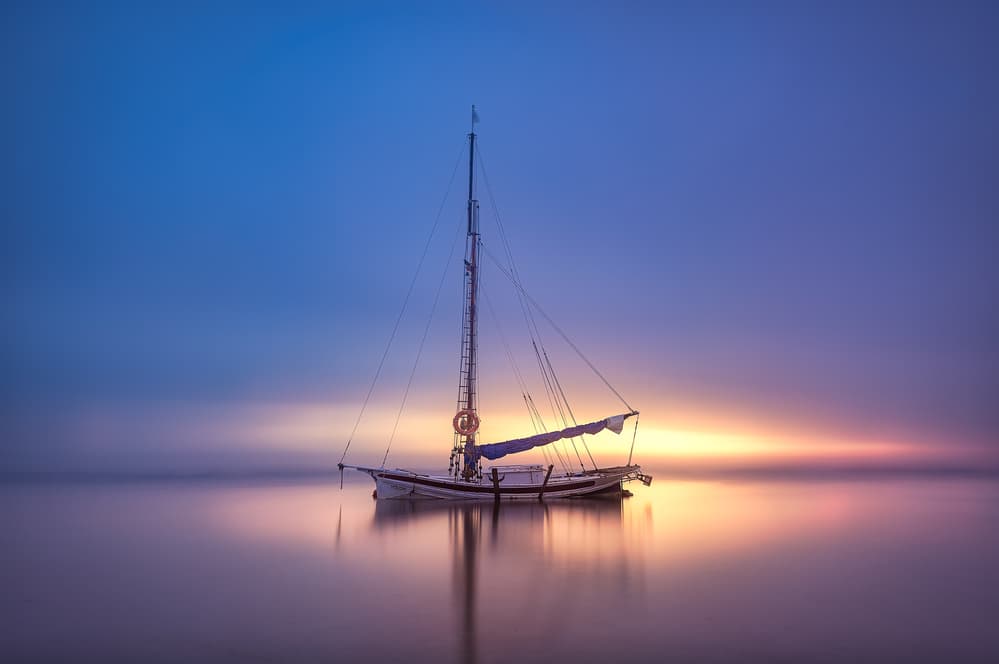 Serene Sunset Sailboat by Jose Antonio Triviño Sanchez — canvas wall art