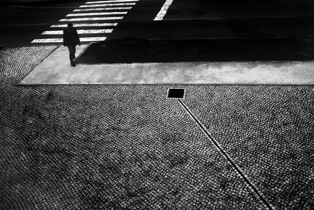Lone Figure Urban Shadow by Paulo Abrantes — canvas wall art
