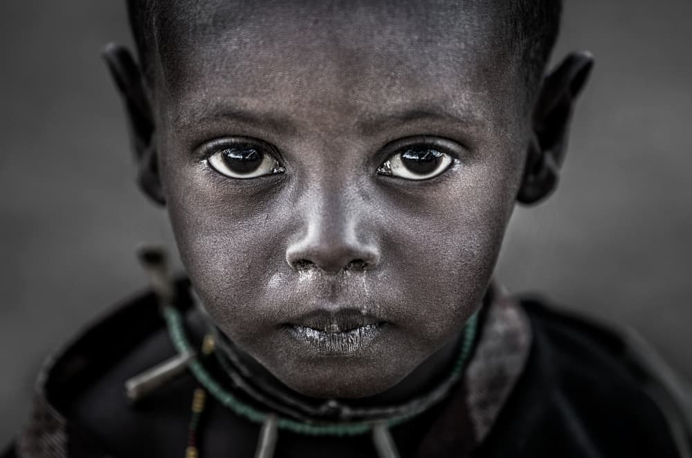 Child's Deep Gaze by Joxe Inazio Kuesta Garmendia — canvas wall art