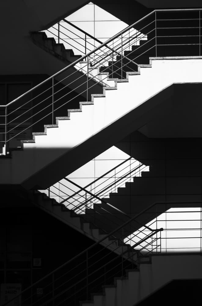 Geometric Stairwell Shadows by Swen MUN — canvas wall art