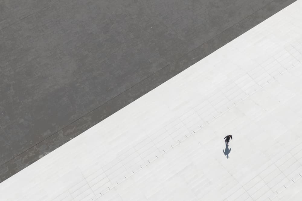 Lone Figure Long Shadow by Yifan Wu — canvas wall art