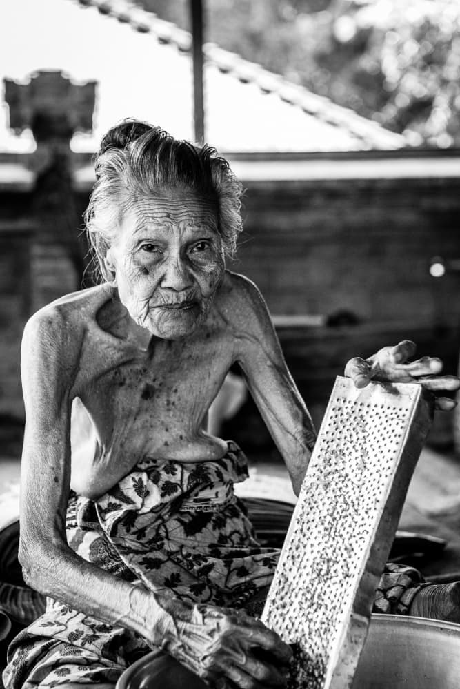 Elderly Woman Grating by Luís Godinho — canvas wall art