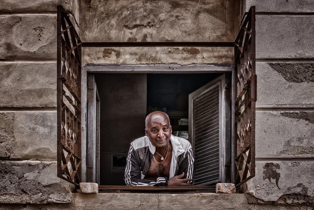 Smiling Man In Window by Pavol Stranak — canvas wall art
