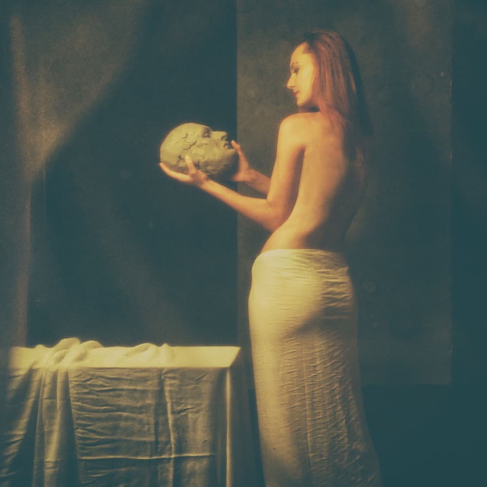 Woman Holding Clay Head by Dan-Stefan Susa — canvas wall art