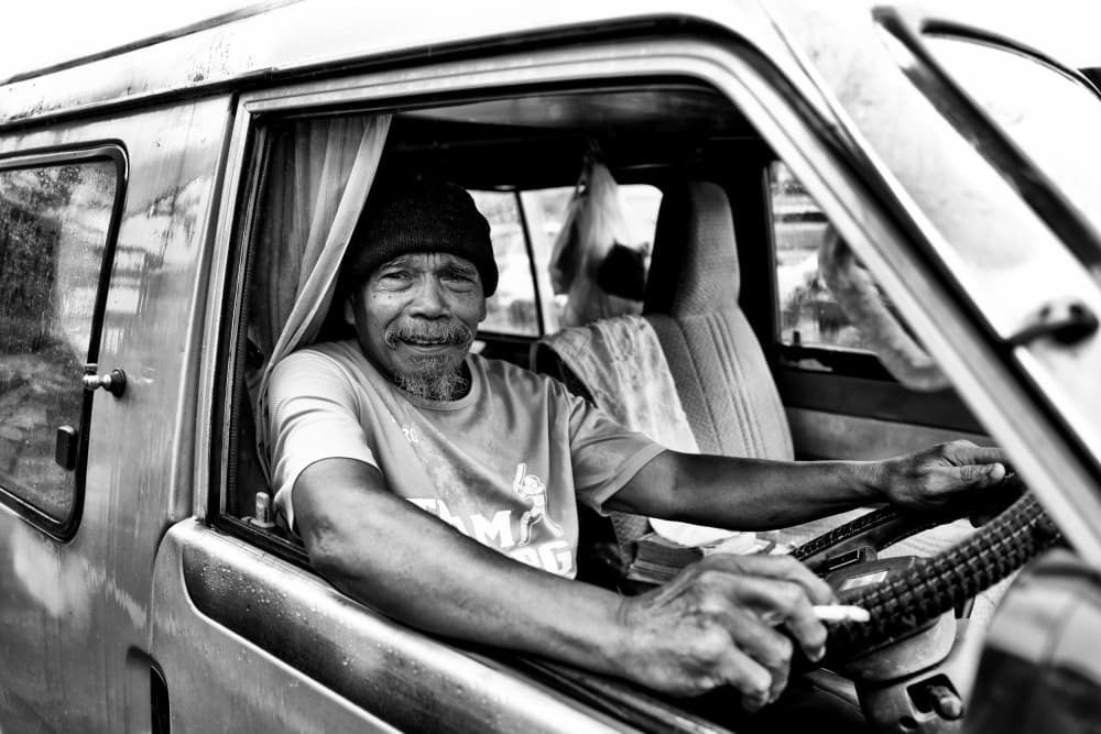 Smiling Man in Car by Kieron Long — canvas wall art