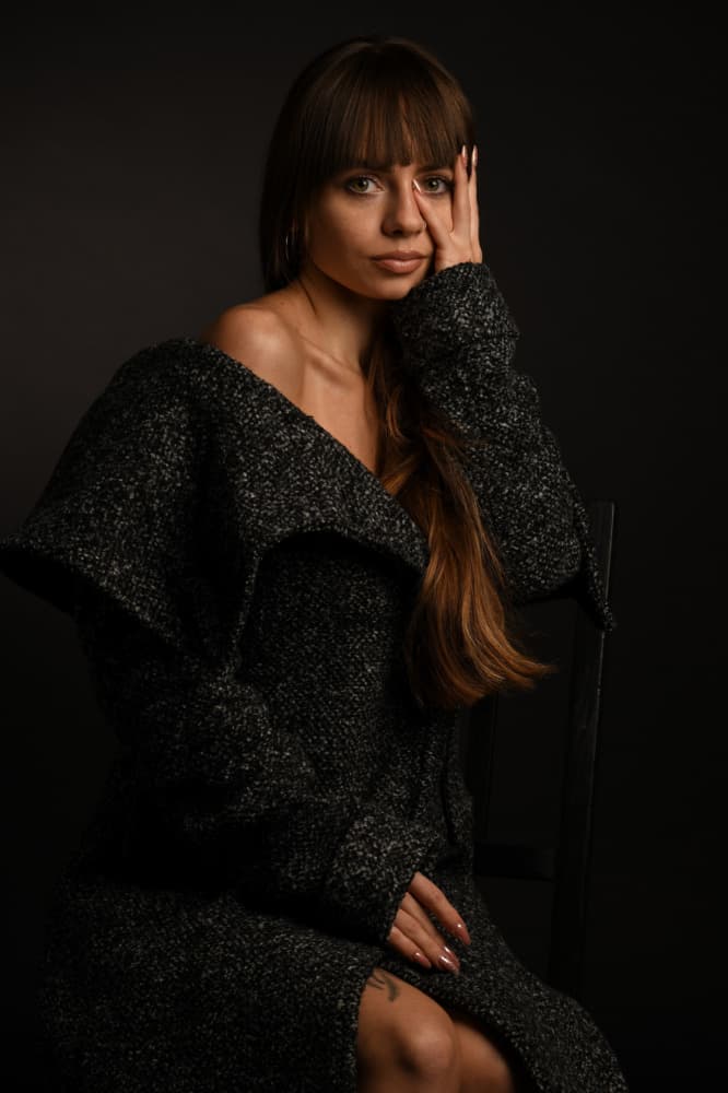Pensive Woman In Coat by Yoram GIL — canvas wall art