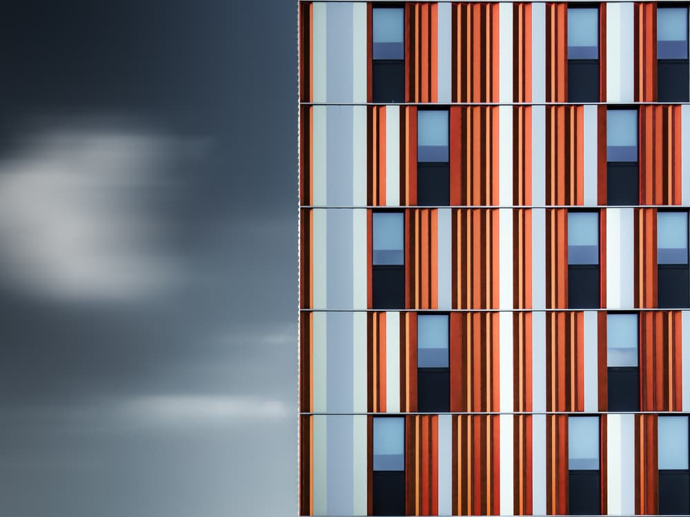Geometric Orange Building by Luc Vangindertael (laGrange) — canvas wall art