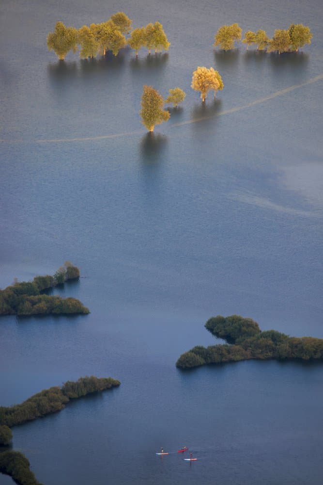 Calm Autumn Lake Kayaking by Milan Malovrh — canvas wall art