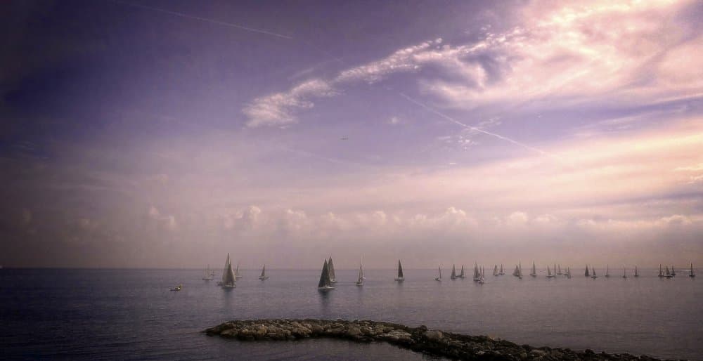 Sailing Under Purple Skies by Anna Cseresnjes — canvas wall art