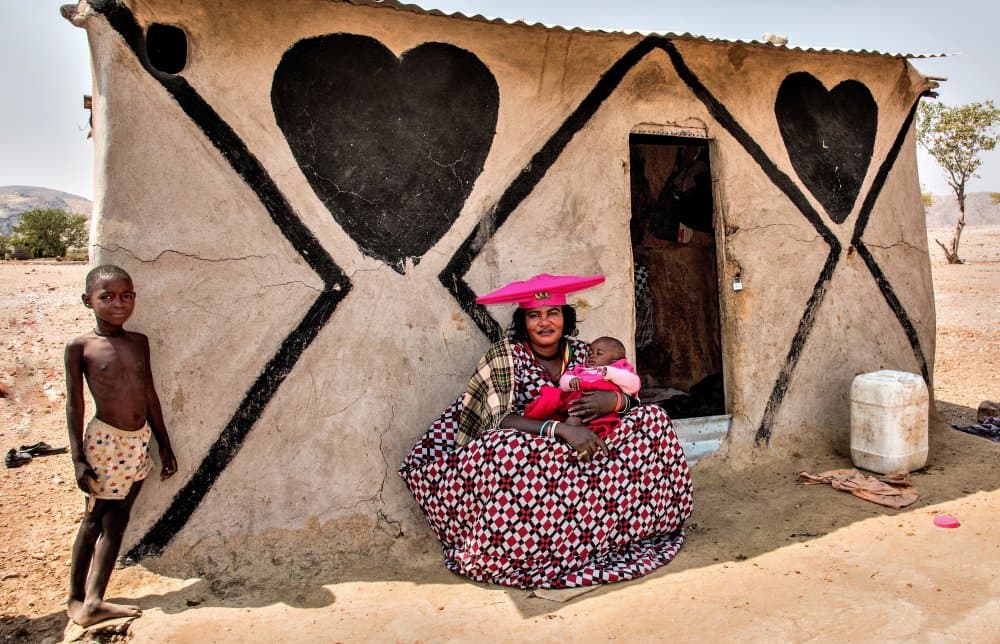 African Mud Home Hearts by Giuseppe DAmico — canvas wall art
