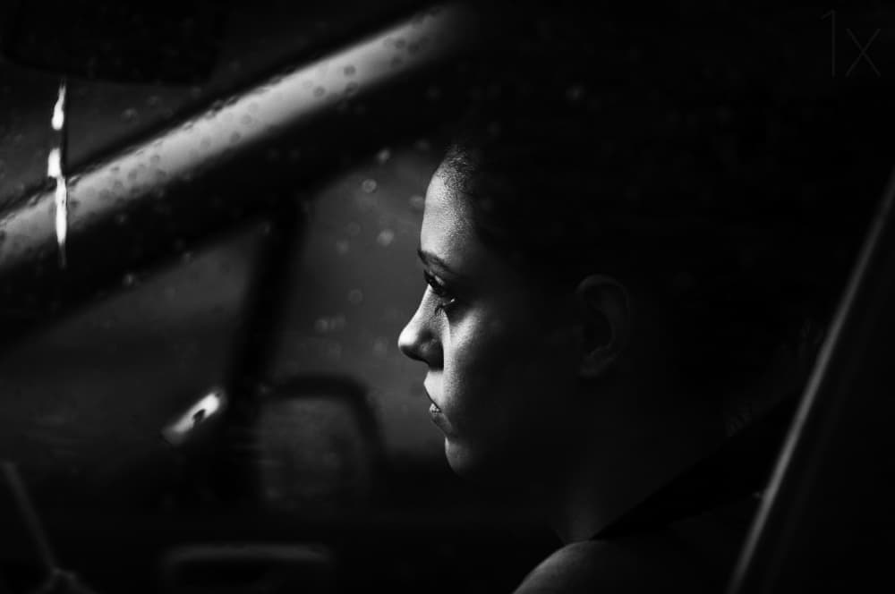 Pensive Woman Rainy Car by Julien Oncete — canvas wall art