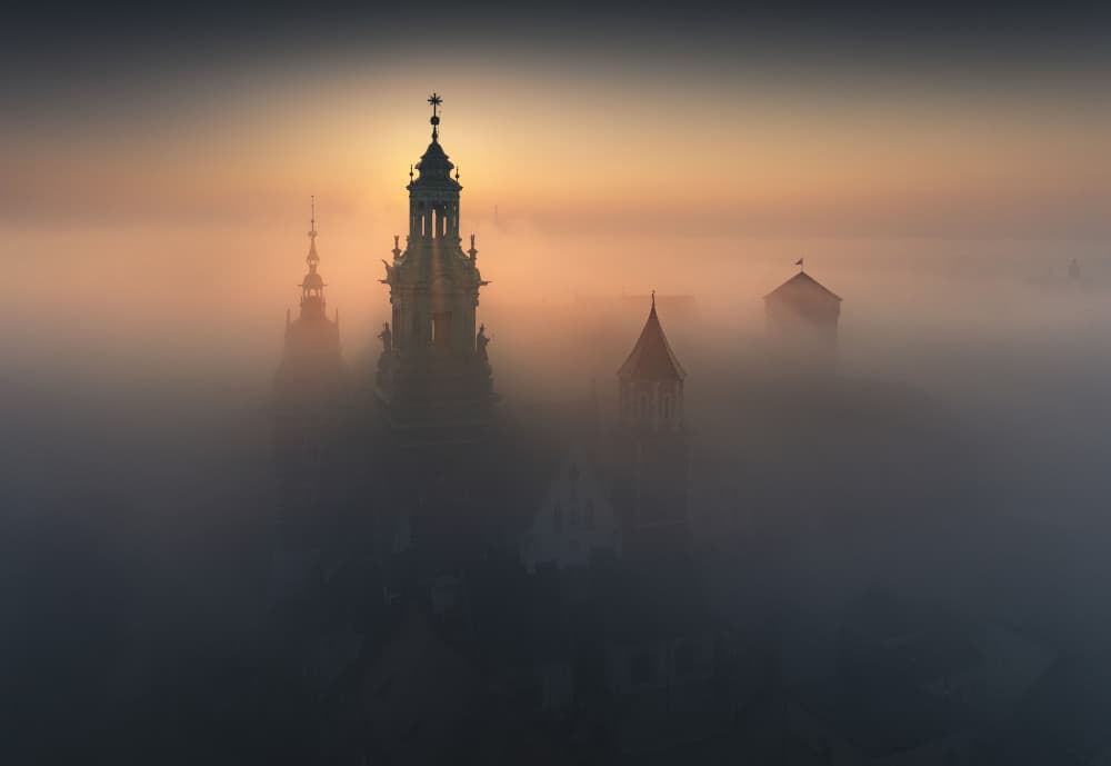 Sunrise Over Foggy Spires by Karol Nienartowicz — canvas wall art