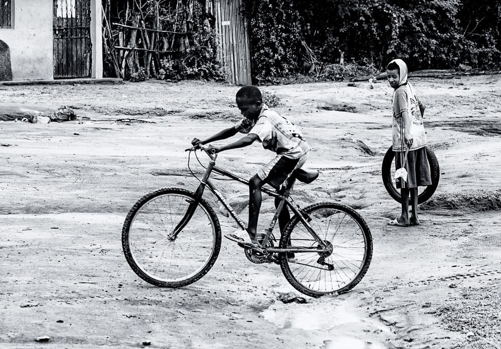 Boy on Bicycle by Amnon Eichelberg — canvas wall art