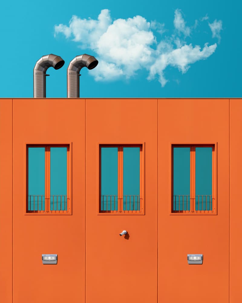 Orange Building Blue Sky by Andrea Comari — canvas wall art