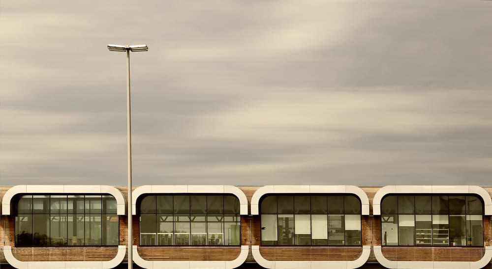 Rounded Windows Under Clouds by Jutta Kerber — canvas wall art