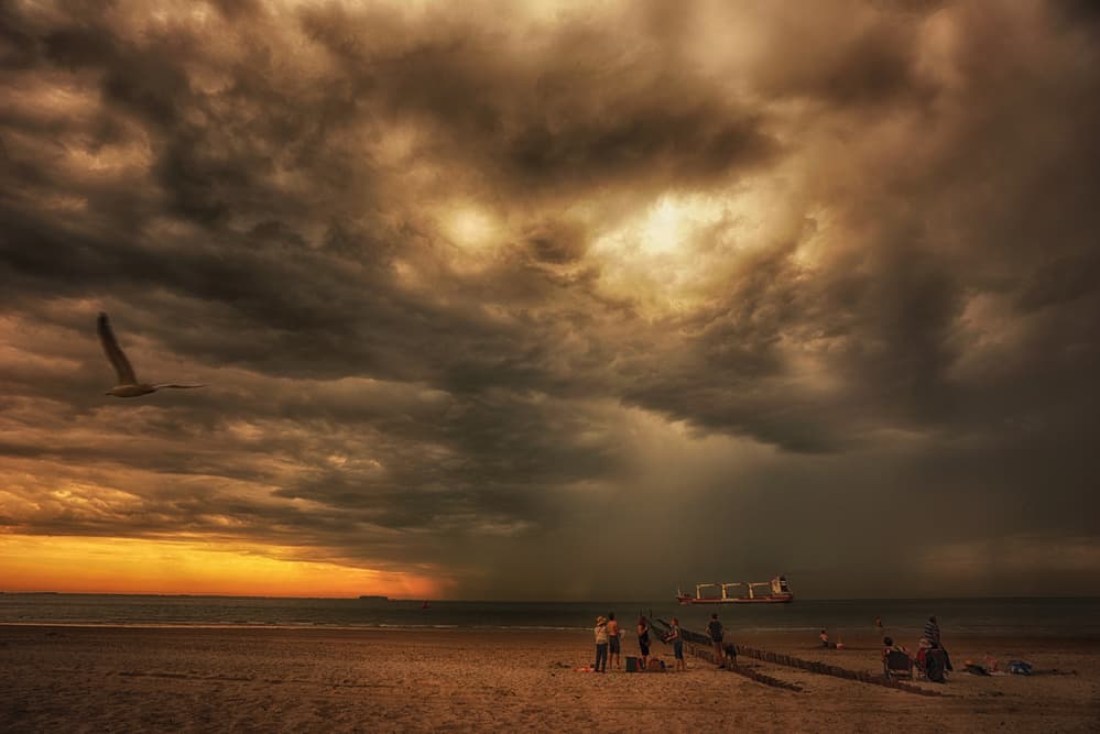 Stormy Sunset Beach by Saskia Dingemans — canvas wall art