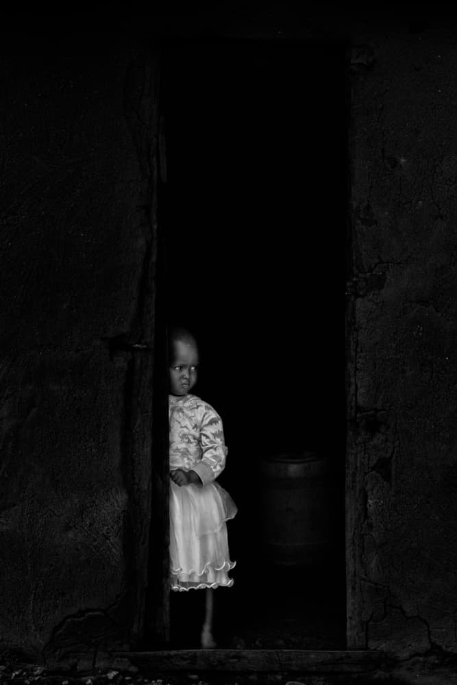 Shy Child In Doorway by Henry Zhao — canvas wall art