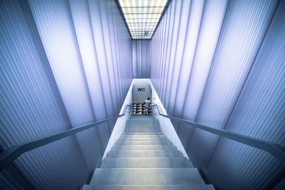 Modern Blue Staircase Descent by Marco Tagliarino — canvas wall art