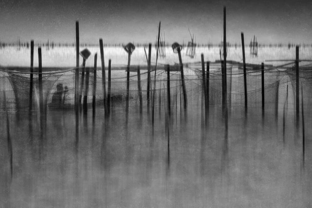 Serene Fisherman Reflection by Ekkachai Khemkum — canvas wall art