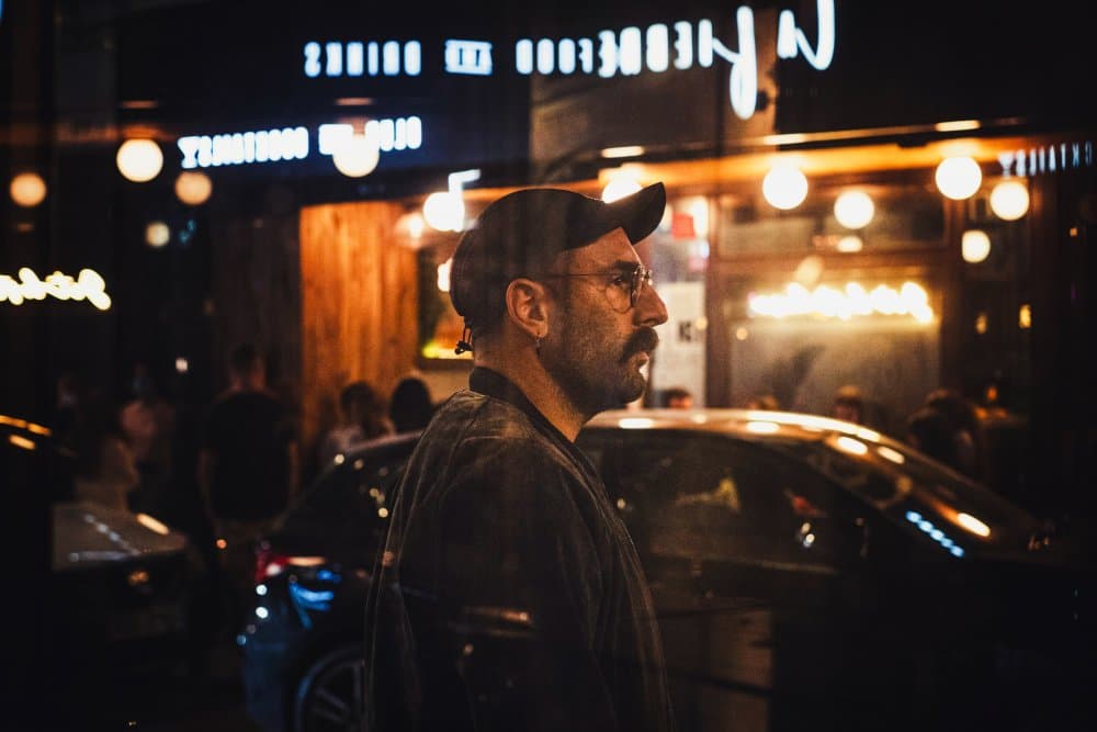 Pensive Man City Lights by Bego Amare — canvas wall art
