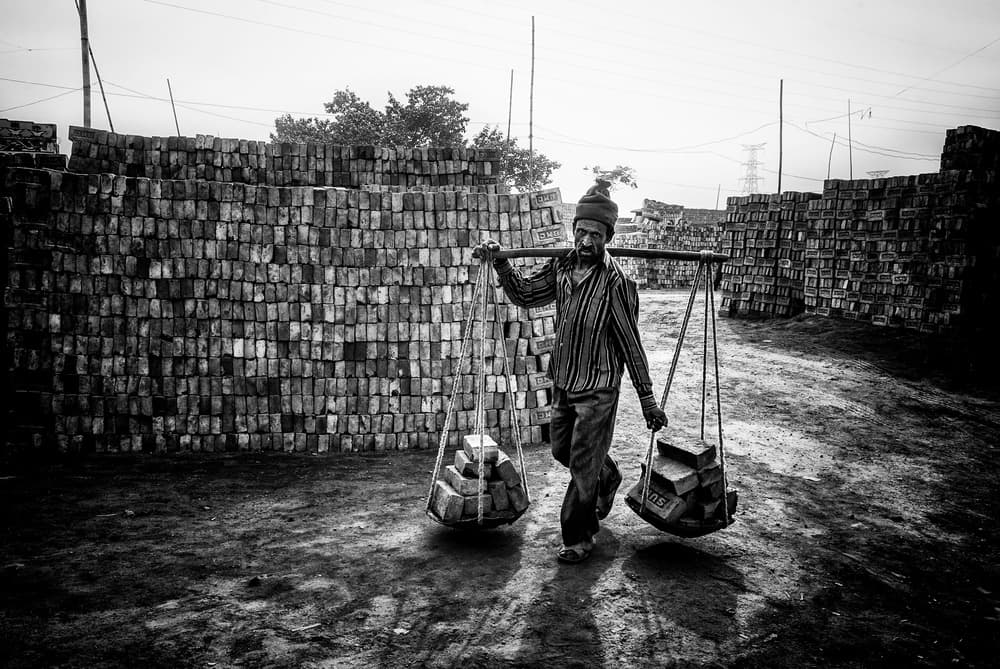 The Brick Carrier by Joxe Inazio Kuesta Garmendia — canvas wall art