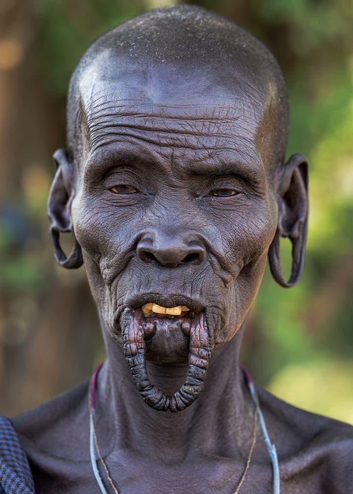 African Lip Plate Portrait by Hamza Qarooni — canvas wall art
