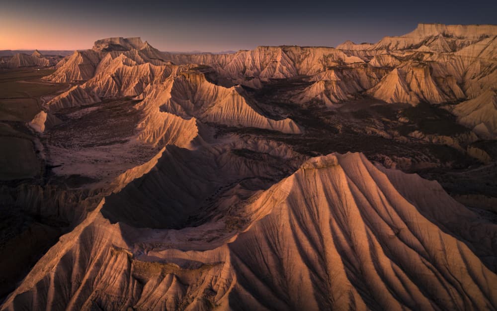 Golden Badlands Sunset by Karol Nienartowicz — canvas wall art