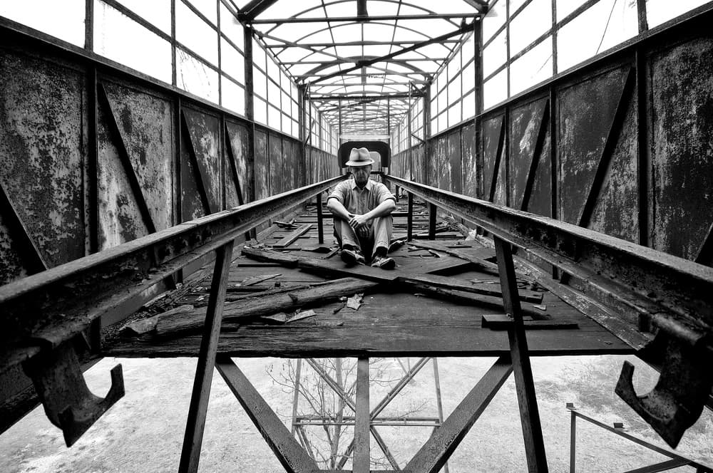Man on Rusty Bridge by Carlo Ferrara — canvas wall art