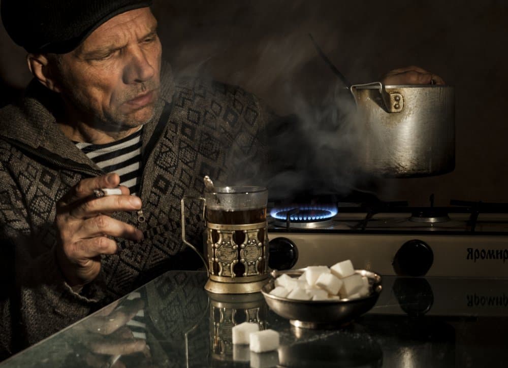 Pensive Man Smoking Tea by Viktor Cherkasov — canvas wall art